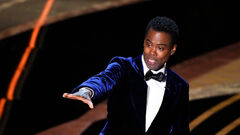The Real Reason Chris Rock Didn't Slap Will Smith Back 