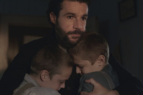 Christopher Abbott as Adam Trask with his young sons in East of Eden (2026). In the finale, a second stroke leaves Adam paralyzed, and his last word goes to Cal