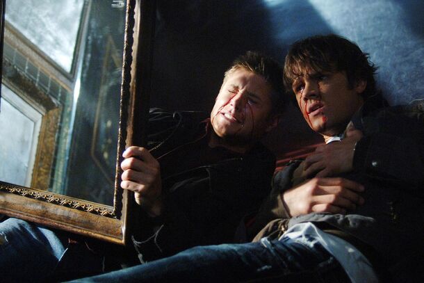 Sam and Dean Winchester with a cursed painting in Supernatural