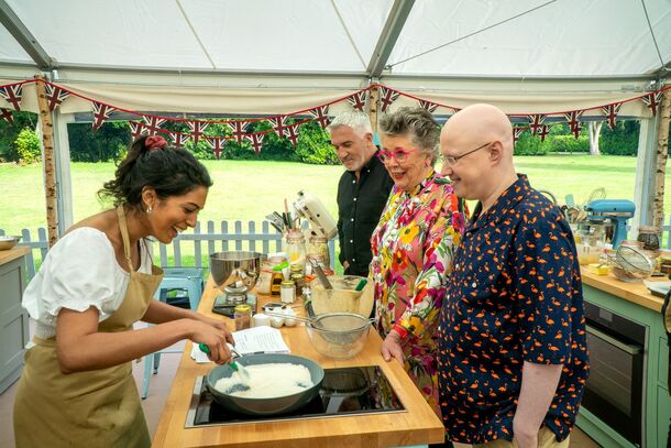 A baker presenting to the judges in the tent on The Great British Bake Off