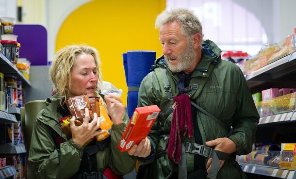 Gillian Anderson and Jason Isaacs in a shop in The Salt Path