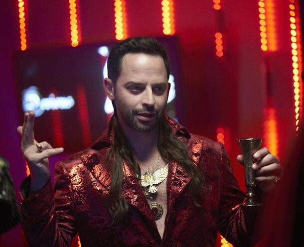 Nick Kroll among a crowd of immaculately turned-out neighbours in a sunlit suburb