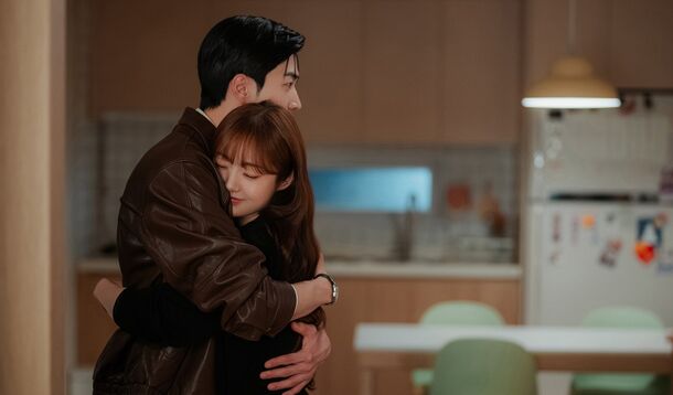 The two leads of My Bias, My Boss (2026) in an embrace. The finale sends Da-reum to Paris for work, then brings her home to a proposal in the park