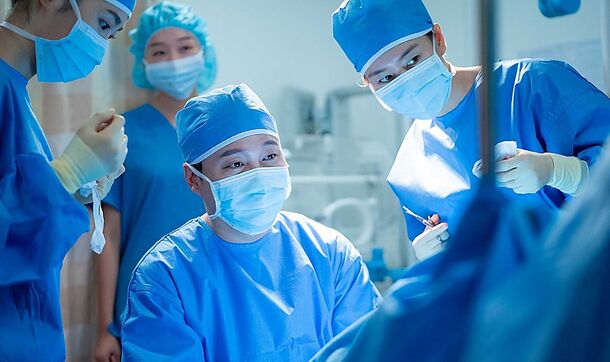 Doctors in surgery in Hospital Playlist (2020). All five of its professors drop by Yulje's Jongno branch in the spin-off Resident Playbook