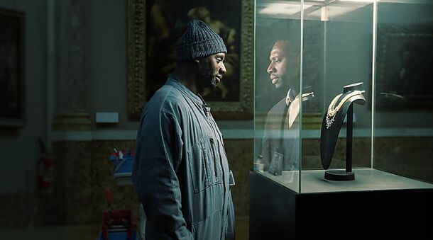 Omar Sy as Assane Diop at a museum display case in Lupin Part 4 (2026). The finale's heist runs through the Varenne Procedure, a security firm's emergency transfer of its clients' assets