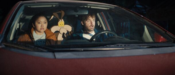 Lana Condor and Will Forte in the car with Wile E. Coyote in Coyote vs. Acme (2026). Warner Bros. shelved the finished film as a tax write-off in 2023, and its theatrical release grossed more than $100 million worldwide