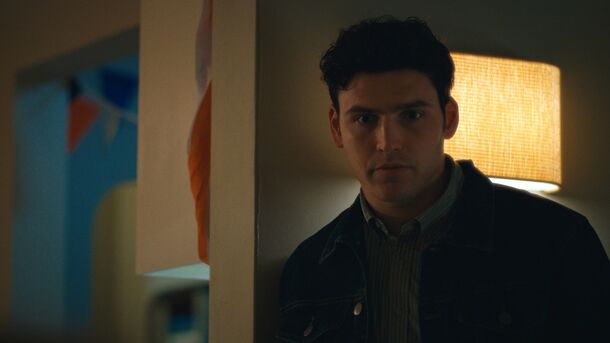 A young man in a dim room in Maximum Pleasure Guaranteed (2026). Apple renewed the thriller, which ran for 10 episodes from May 20 to July 15, for a second season in October