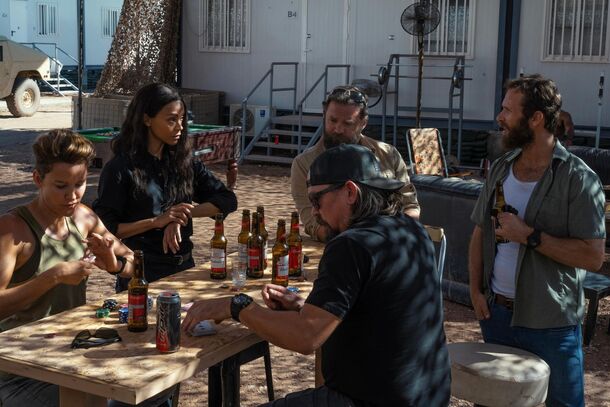 The Lioness team around a table at the base