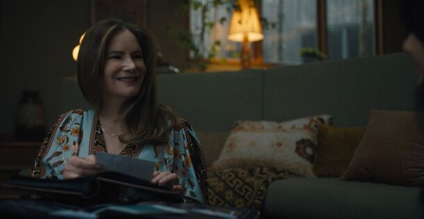 Jennifer Jason Leigh on the sofa in Something Very Bad Is Going to Happen
