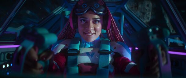 A racer lit by neon at the wheel in Black Mirror