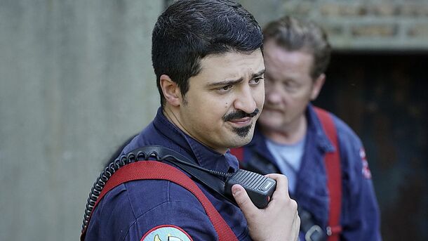 A Firehouse 51 firefighter calling in on the radio at a scene