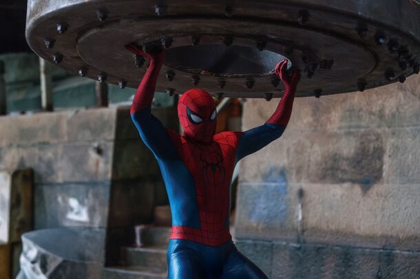 Spider-Man lifting a steel platform in the street in Brand New Day
