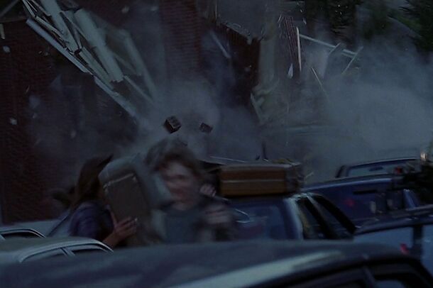 Volcanic ash and debris sweeping over a street in Dante's Peak