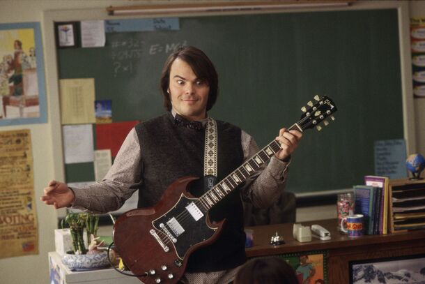 Jack Black in School of Rock (2003), playing the guitar model Angus Young made famous. The film's finale puts him on stage in a schoolboy uniform