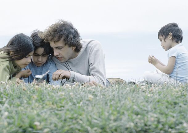 Teens around a single screen — soon on a two-hour clock