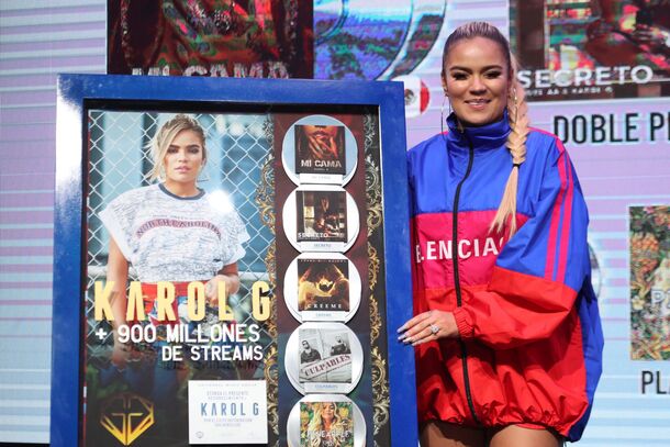 Karol G with a streaming plaque — her album handed Bruno Mars his oddest chart week