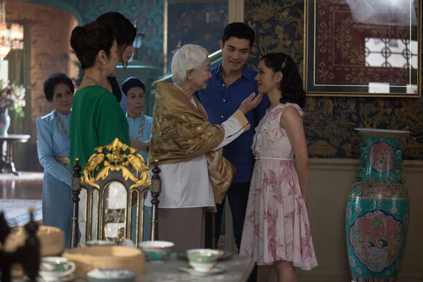 Michelle Yeoh, Constance Wu and Henry Golding in Crazy Rich Asians (2018). All three are coming back for HBO's eight-episode series, with Yeoh recurring as Eleanor
