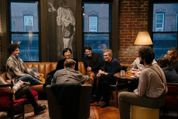 Young literati in a downtown bar in Late Fame (2025). The film moves Arthur Schnitzler's 1890s Vienna satire of literary vanity to present-day Manhattan