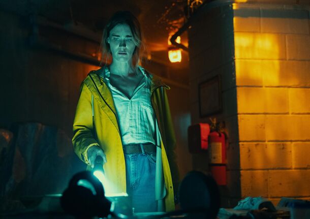 A figure in a yellow raincoat below deck in Below (2026). The six-episode Netflix series drops all at once on October 8