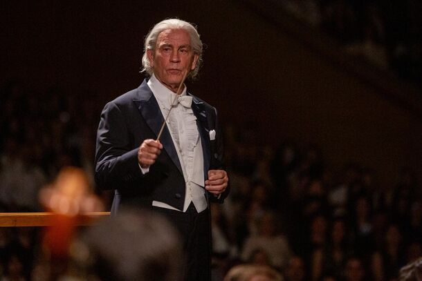 John Malkovich as Sergiu Celibidache in The Yellow Tie (2025). The Romanian conductor led the Berlin Philharmonic after the war, until the orchestra chose Herbert von Karajan