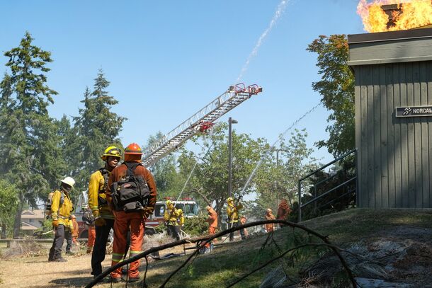 Firefighters battle a roof fire in Fire Country (2022). Season 4 kept circling the Zabel Ridge fire, the blaze that killed Vince Leone