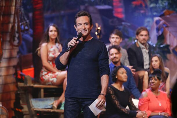 Jeff Probst handing out the tiles to a full cast on the beach. Survivor 51 goes out on Wednesday with 21 players, one more than the two tribes of 10 he describes.