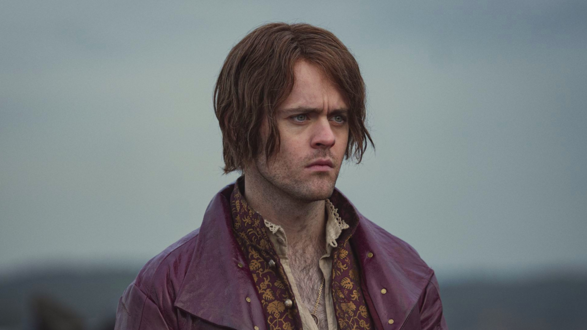 Jaskier from The Witcher with chin-length, straight, center-parted hair Jaskier from The Witcher with chin-length, straight, center-parted hair